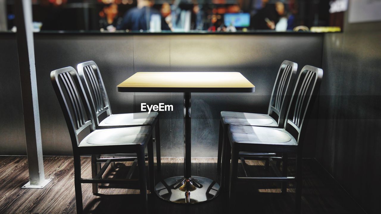 Empty chairs and table in restaurant