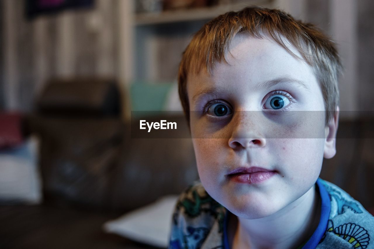 Close-up portrait of boy at home