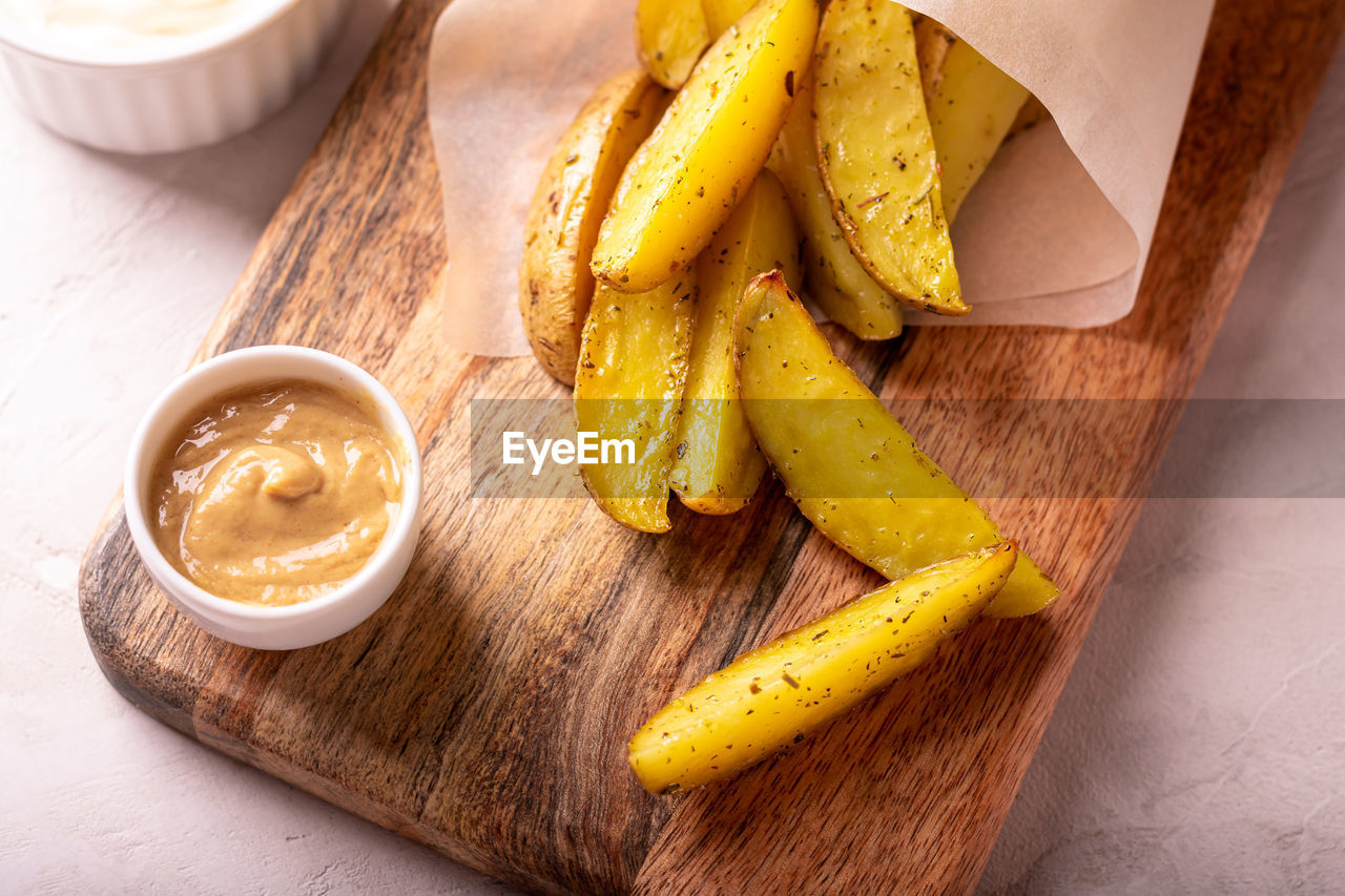 Delicious slices of baked potatoes with rosemary and oil