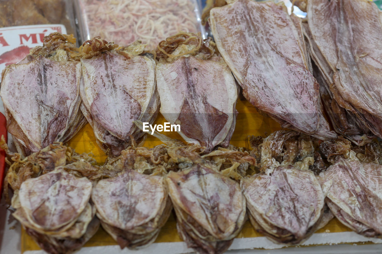 Closeup of deep fresh sun dried squid - traditional vietnamese cuisine in dam market, nha trang city