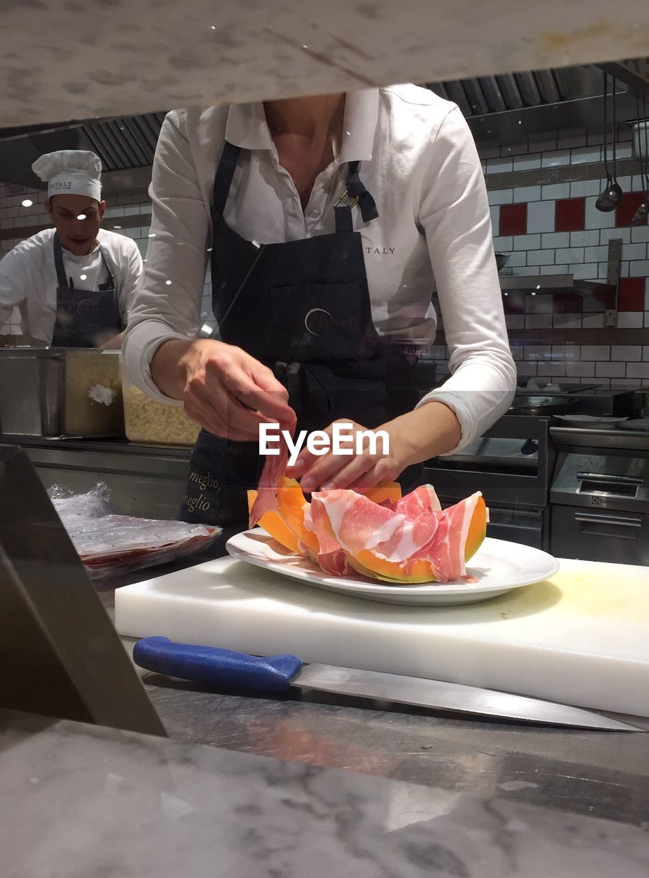 MAN PREPARING FOOD