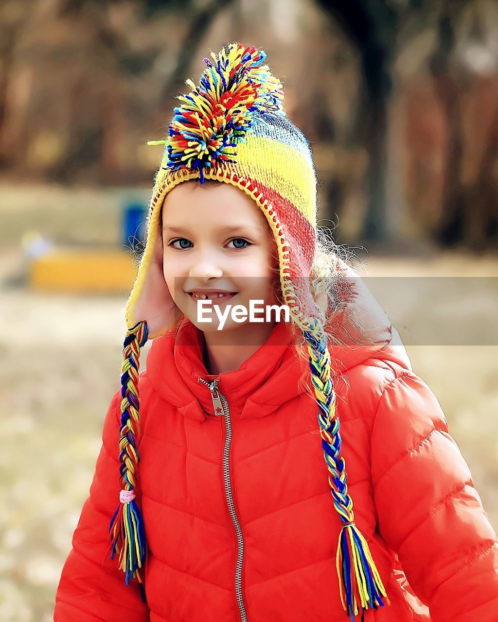 PORTRAIT OF SMILING GIRL WITH SNOW