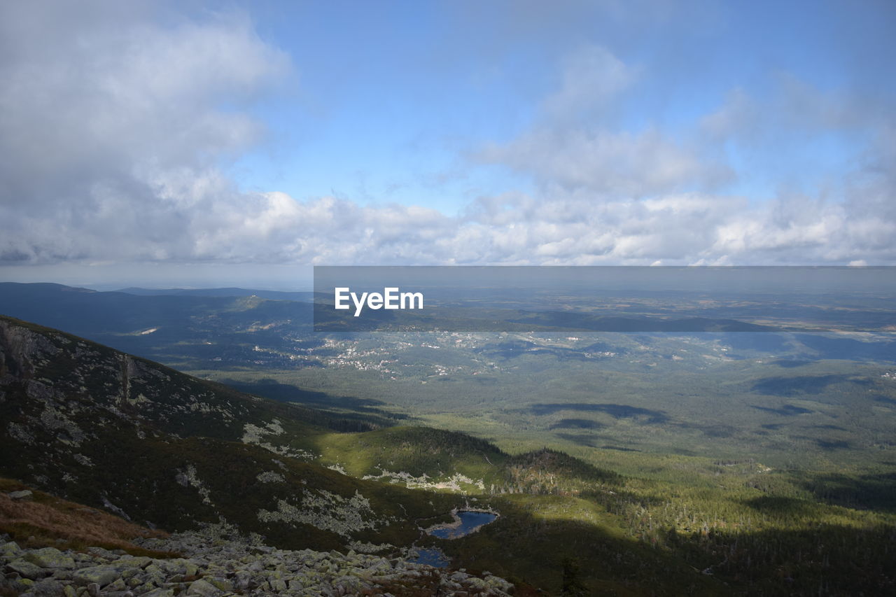 SCENIC VIEW OF LANDSCAPE AND MOUNTAINS AGAINST SKY