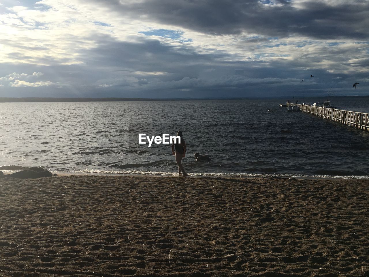 Friends at beach during sunset