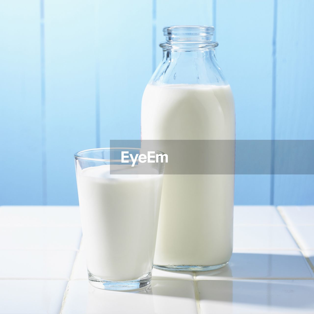 Close-up of milk in glass and bottle