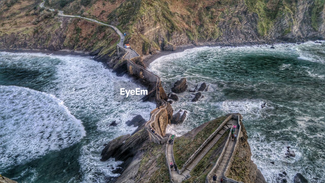 High angle view of walkway on rock formation at gaztelugatxe island