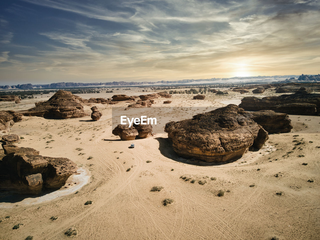 Scenic view of beach against sky during sunset