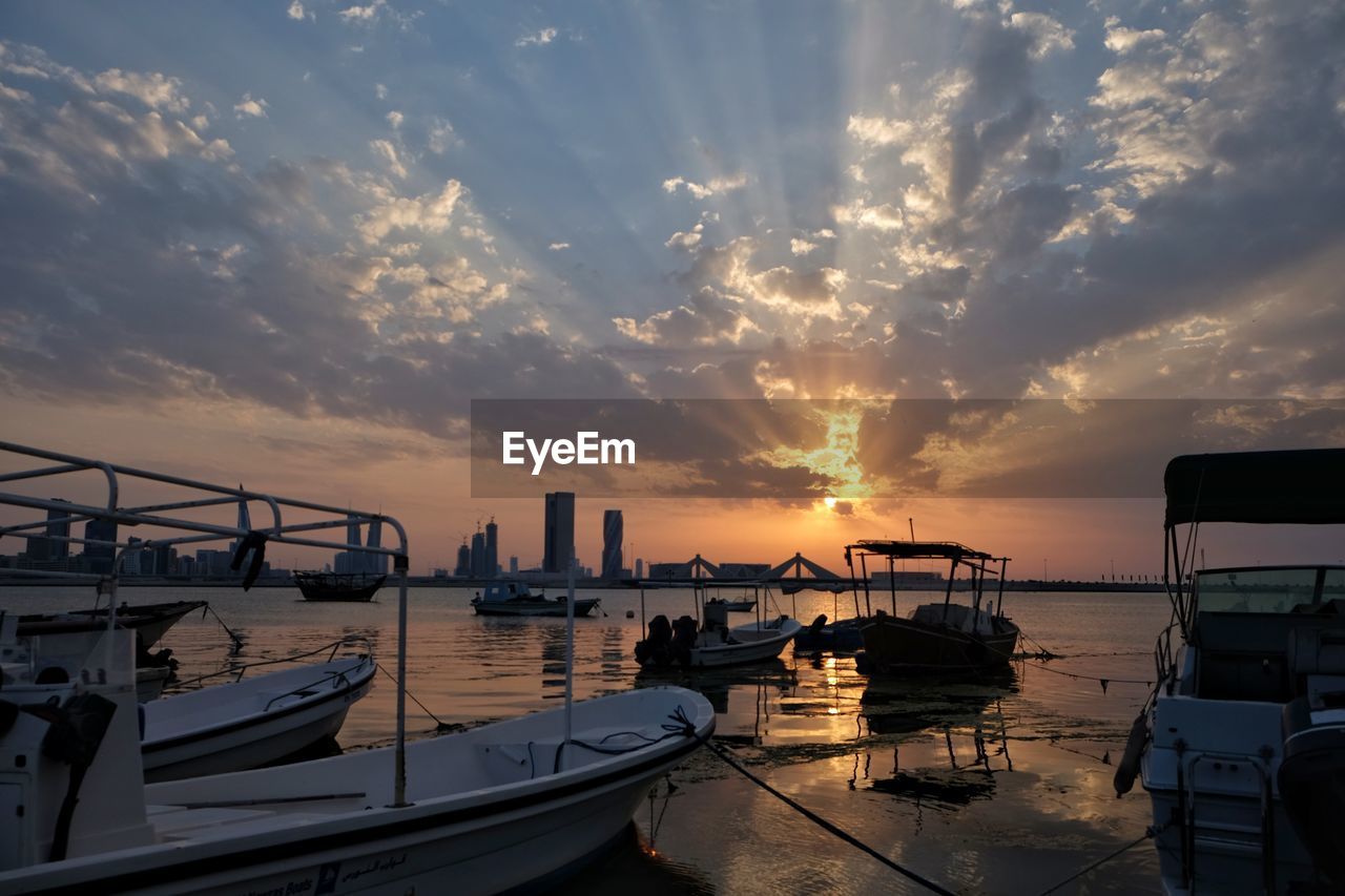 View of harbor at sunset