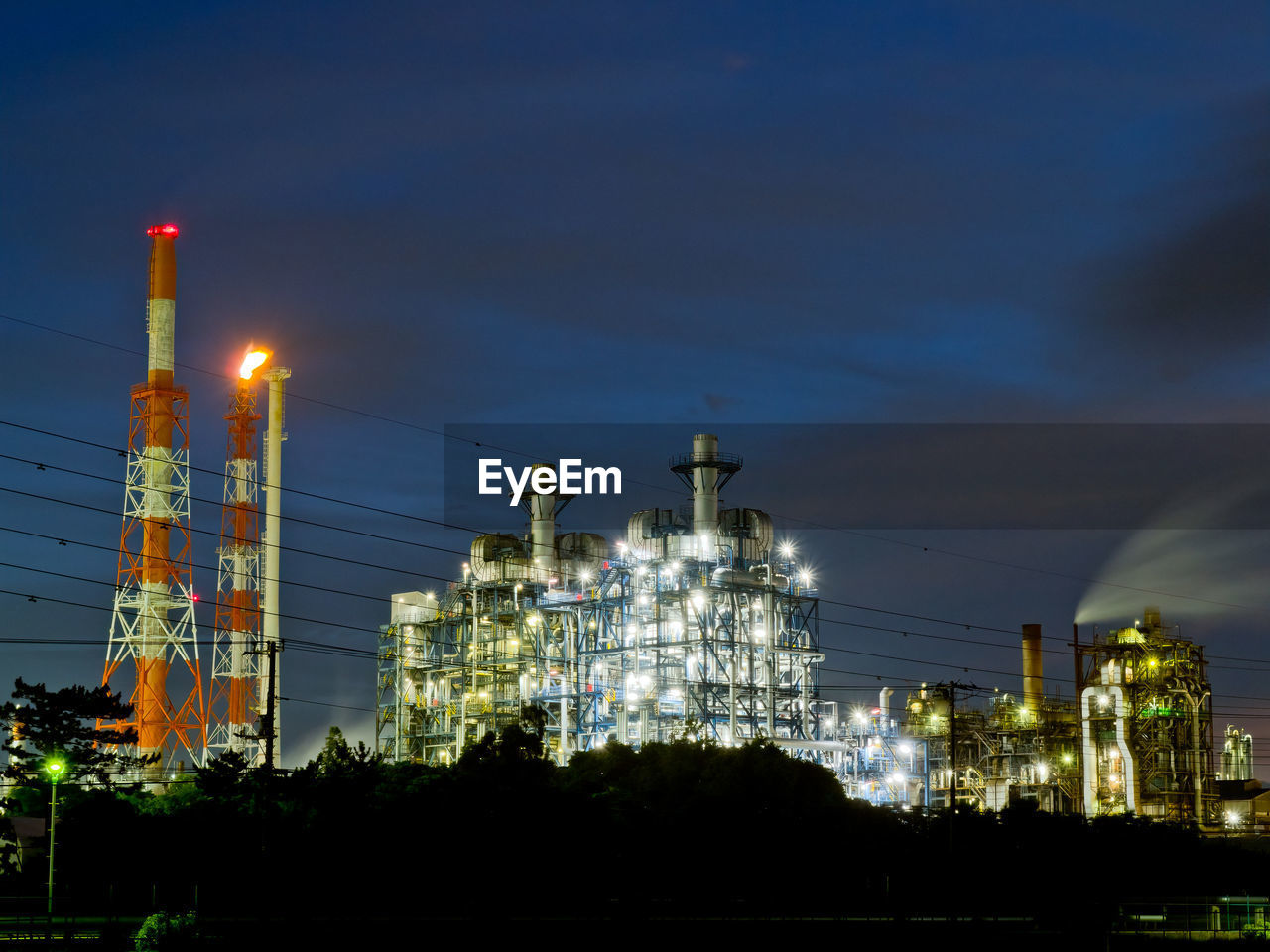 Night view of oil refinery at dusk.