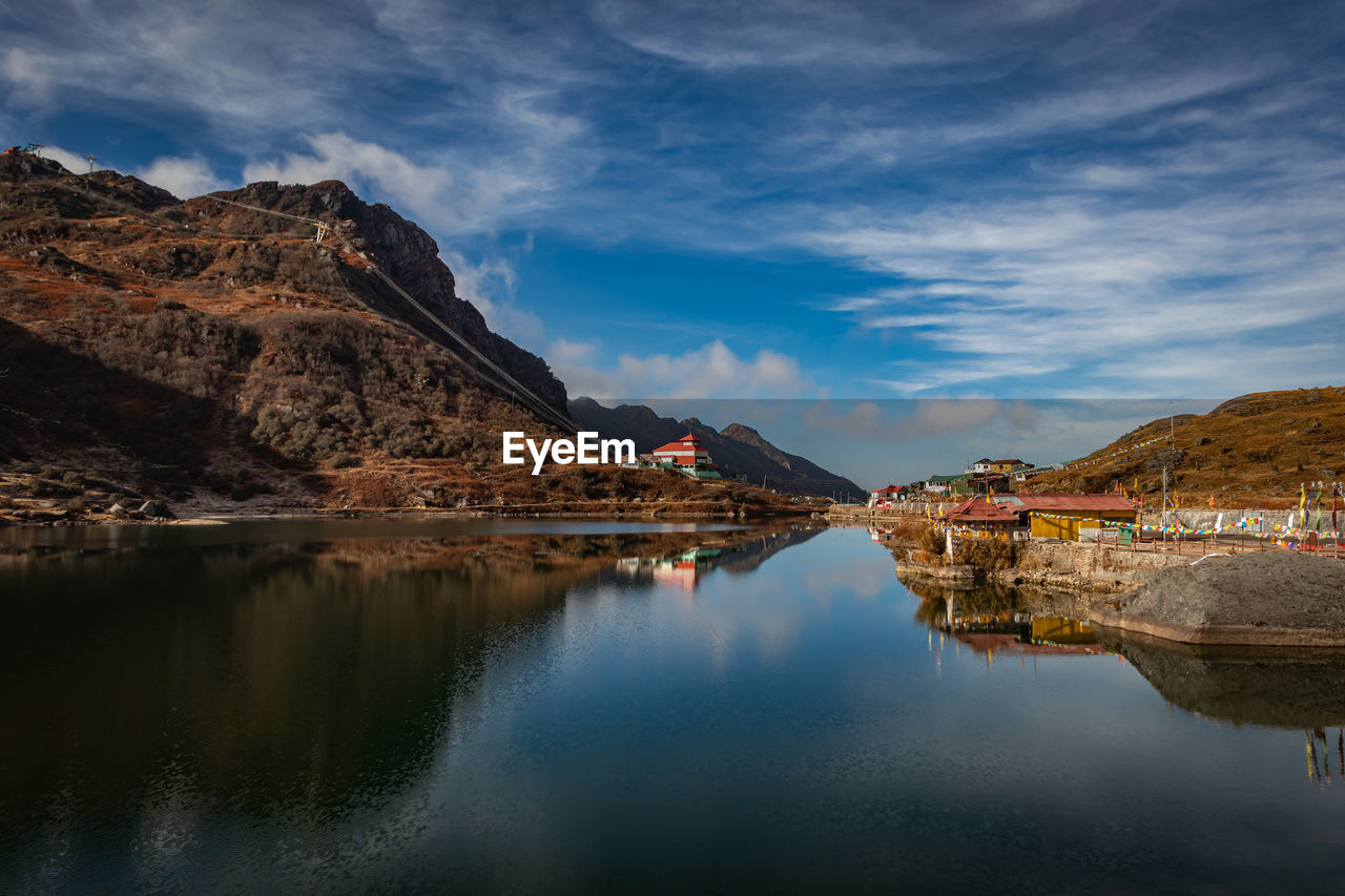 Pristine lake surrounded by himalayan mountain with pristine water reflection isolated view