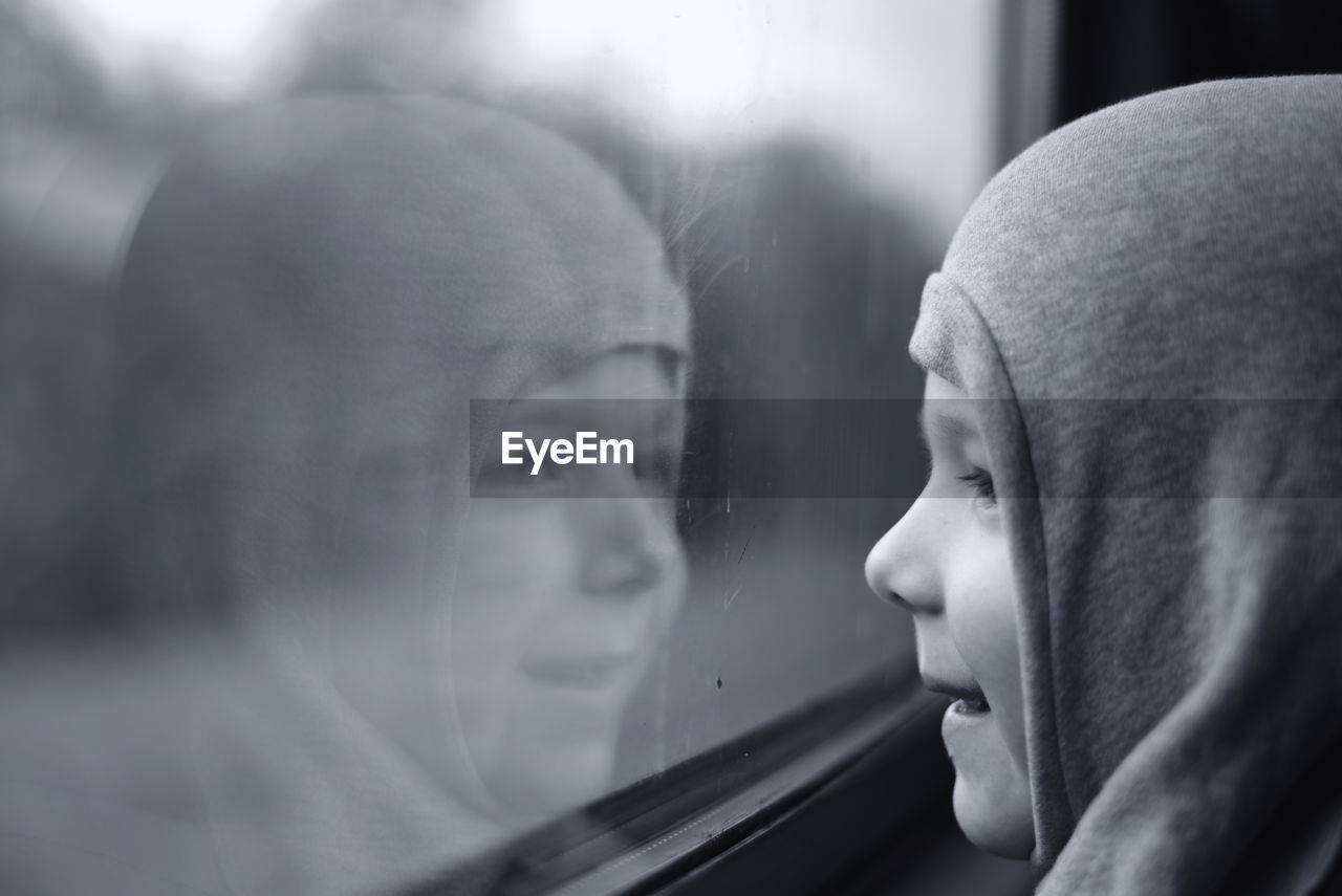 Close-up of child in train