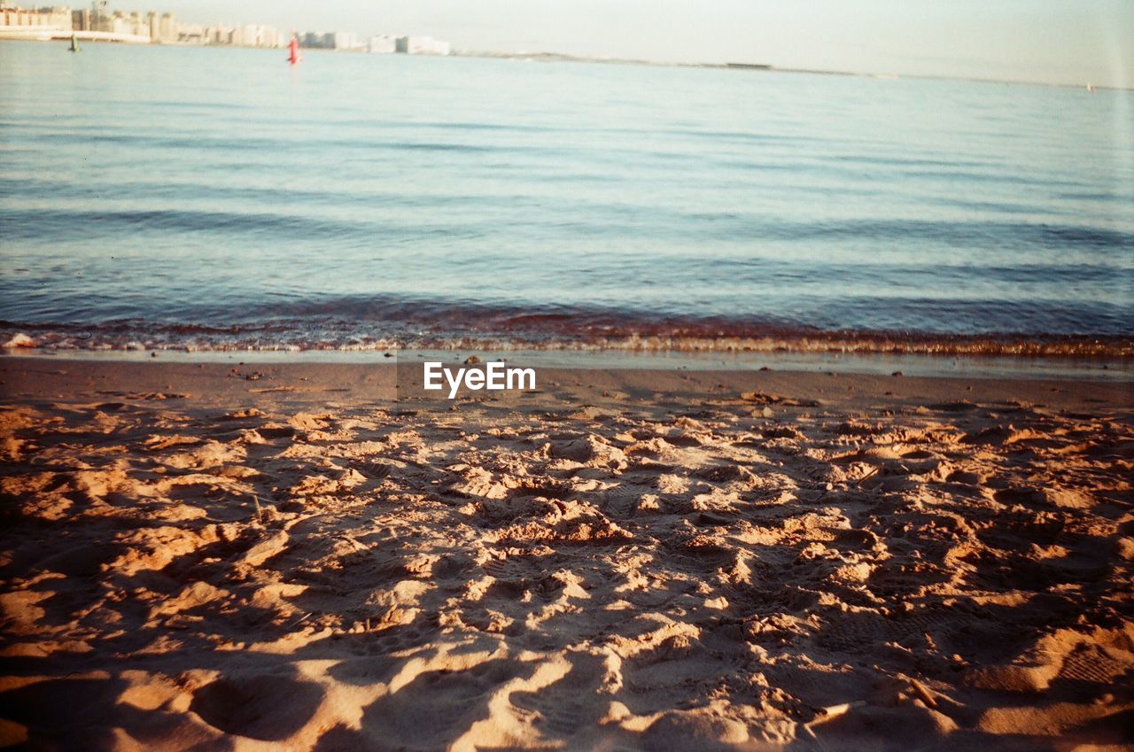 AERIAL VIEW OF BEACH AGAINST SKY