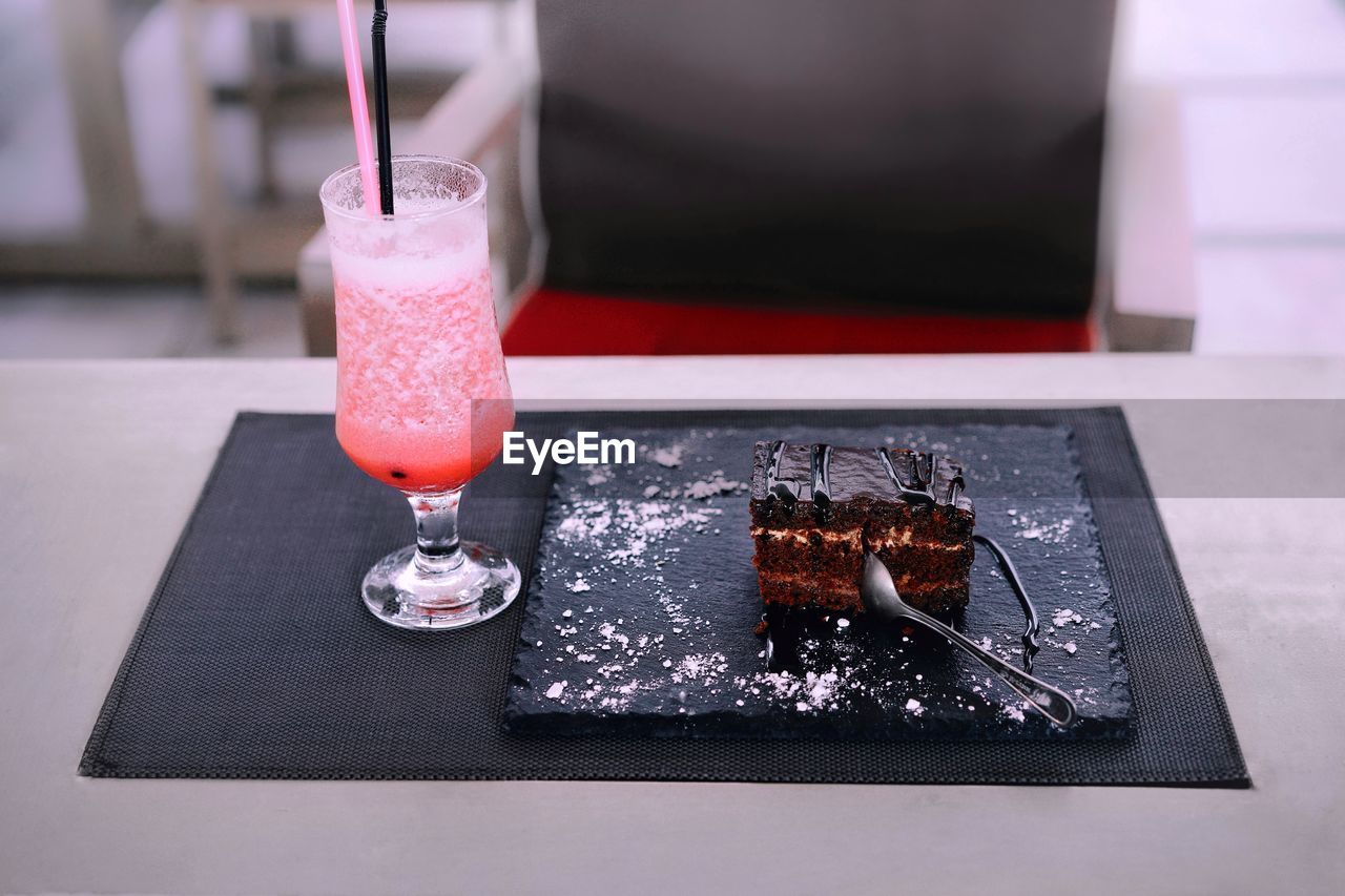 Close-up of drink and dessert on table