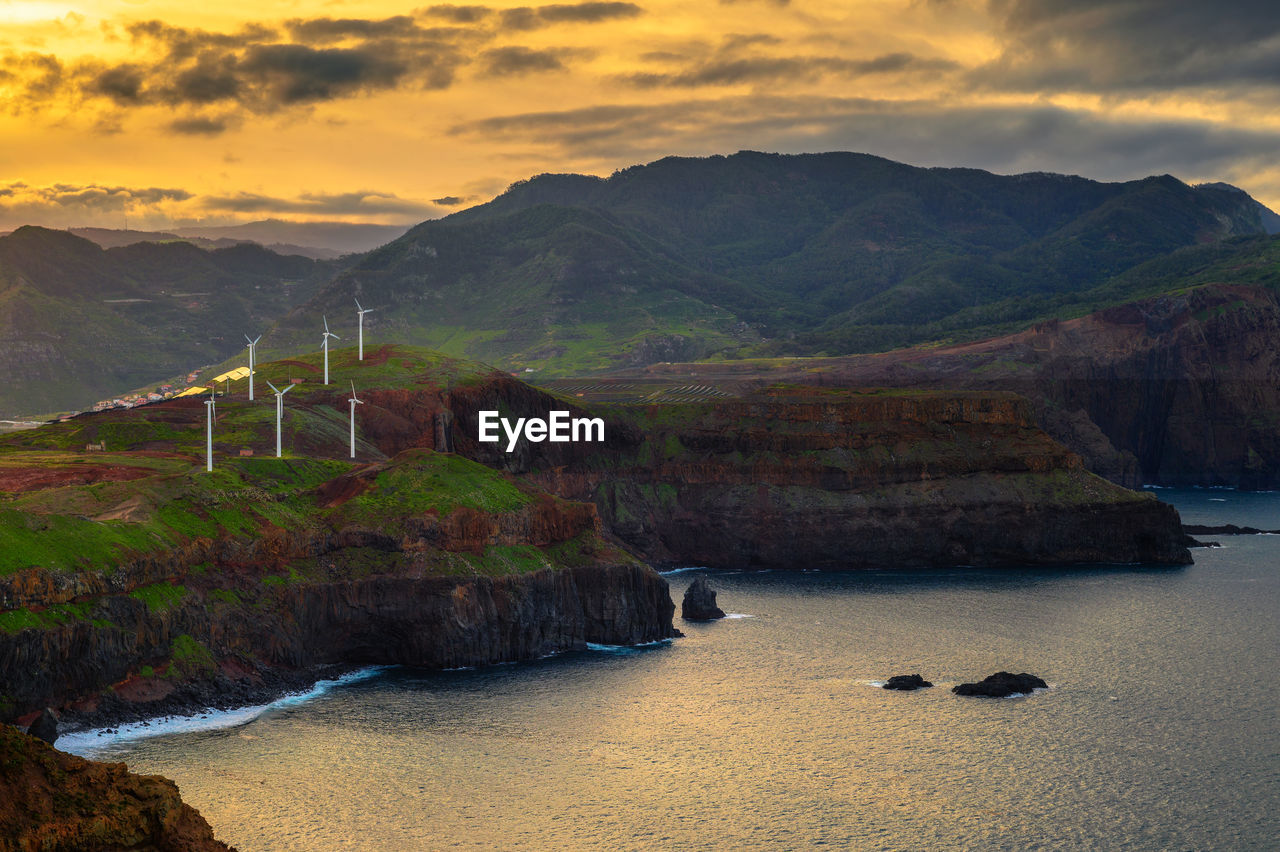 scenic view of mountains against sky during sunset