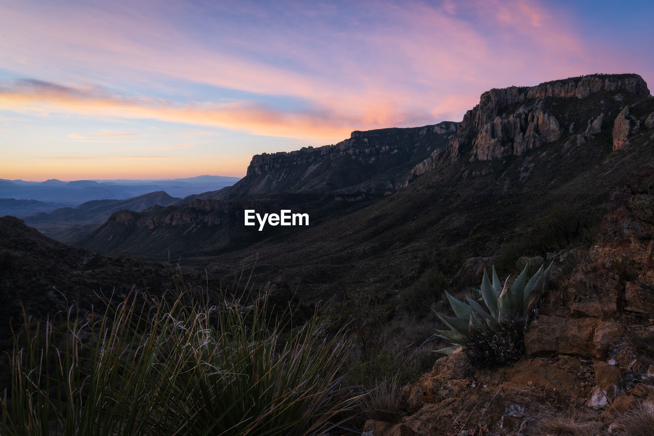 Scenic view of rocky mountains against sky during sunset in big bend national park - texas