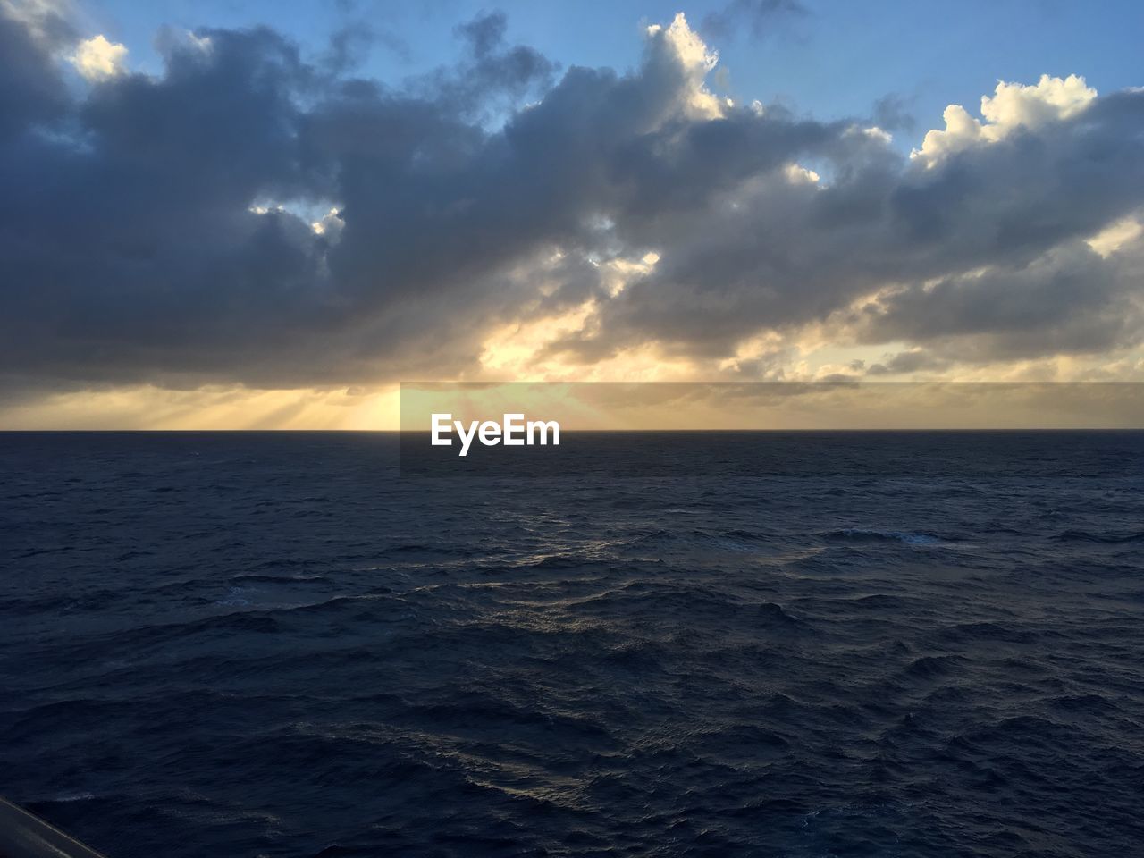 Scenic view of sea against dramatic sky