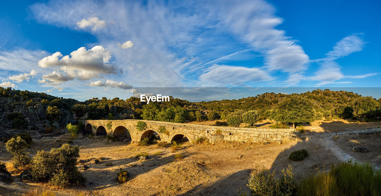 Panoramic of the mocho bridge, of roman origin, near the town of ledesma, spain
