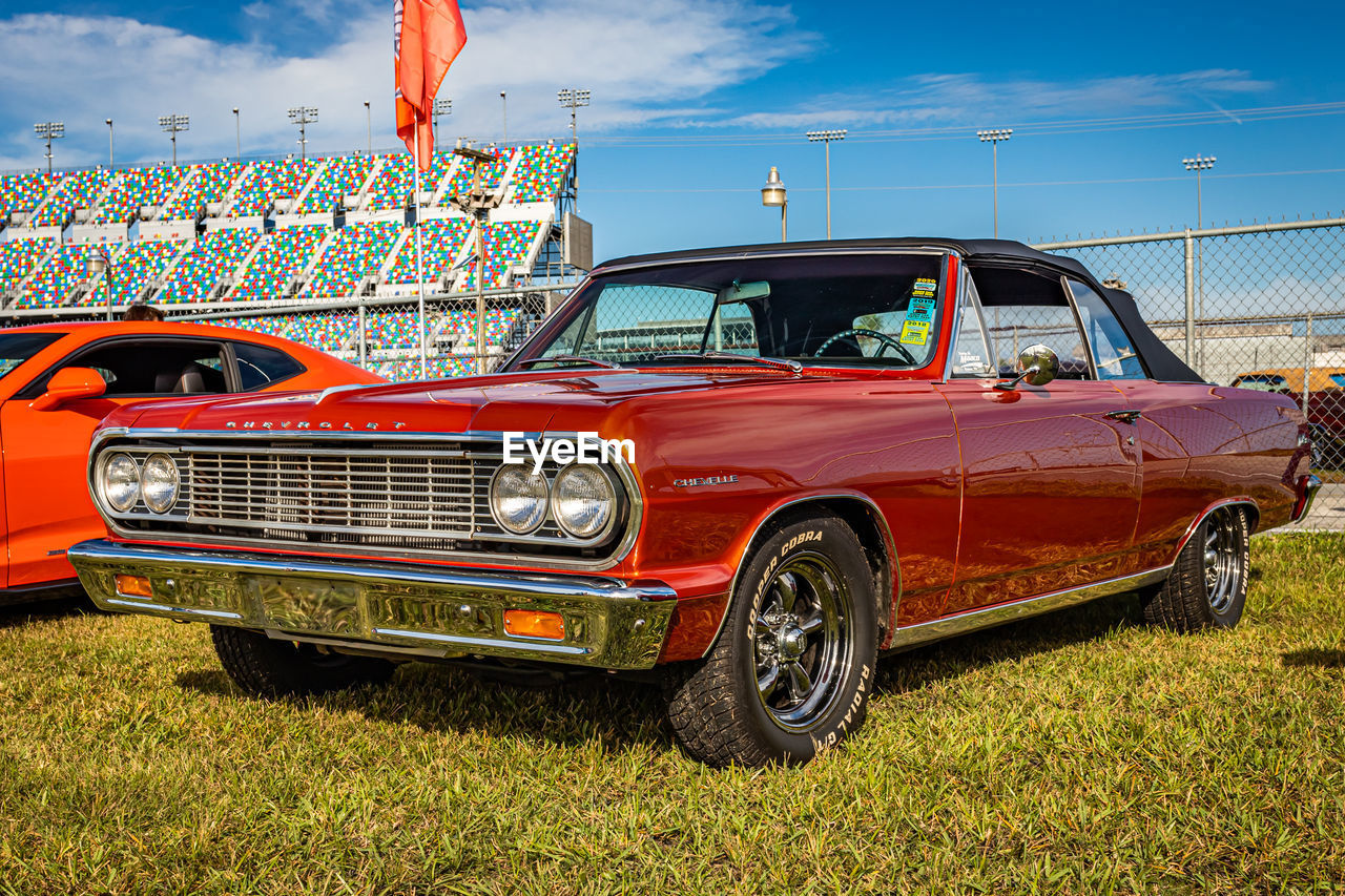 OLD VINTAGE CAR AGAINST SKY