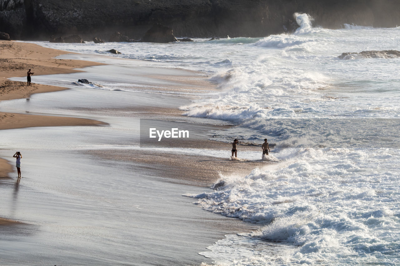 High angle view of people on shore at beach