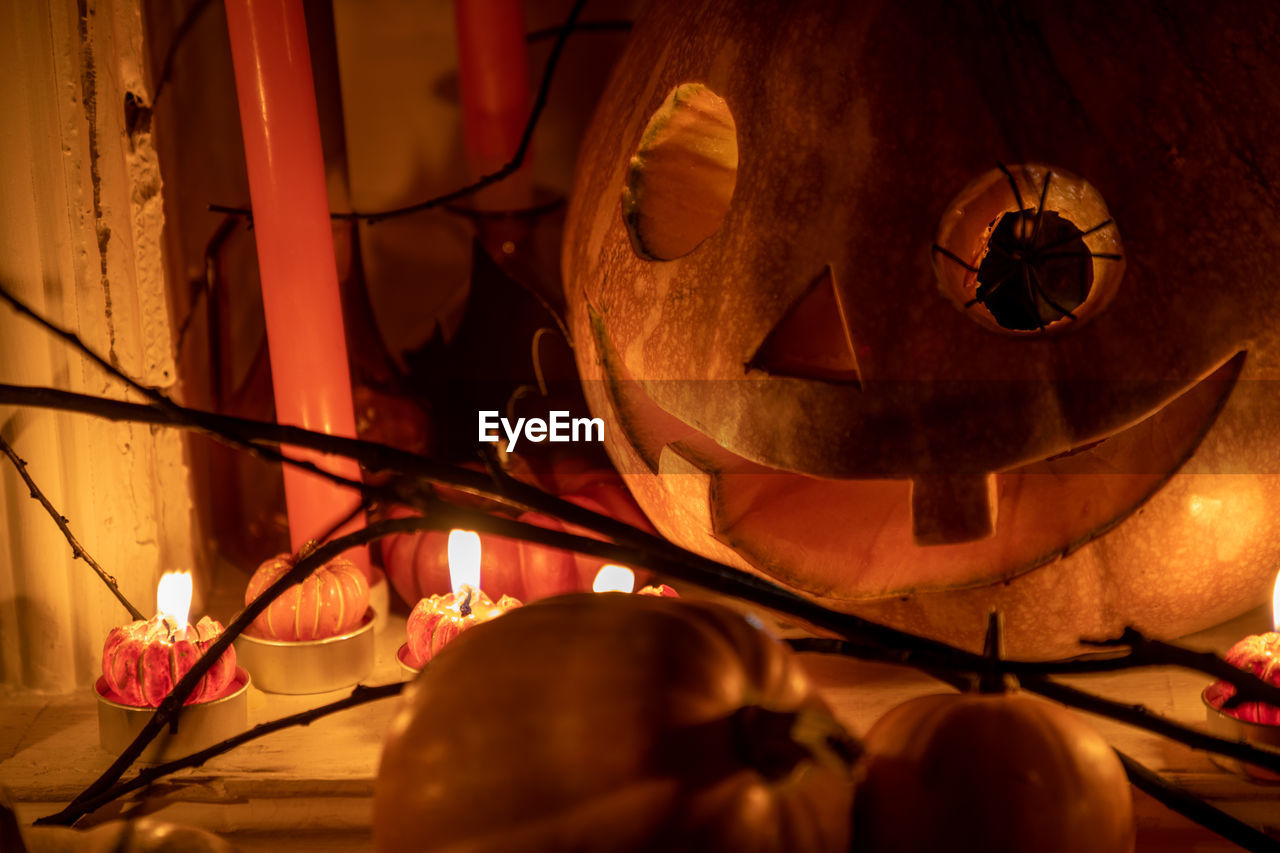 CLOSE-UP OF ILLUMINATED LIGHTING EQUIPMENT ON METAL