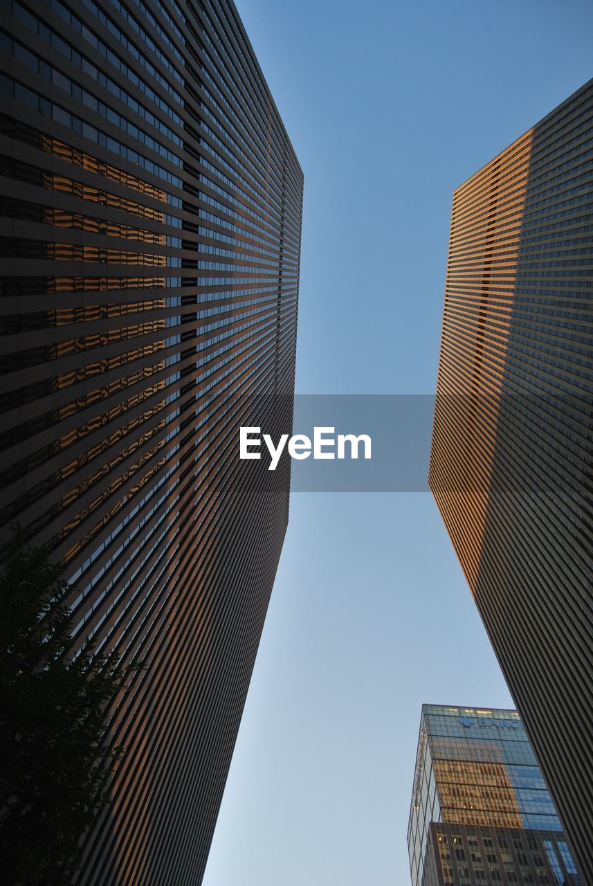 Low angle view of skyscraper against clear sky