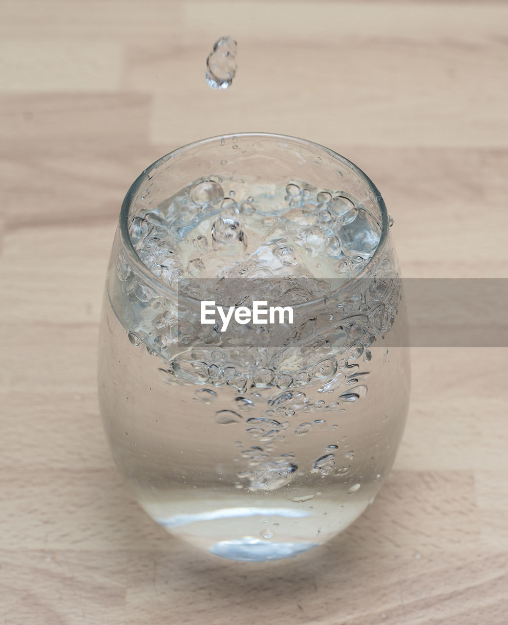 Close-up of drinking glass on wooden table