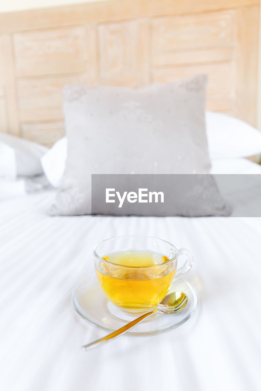 View of green tea on bed