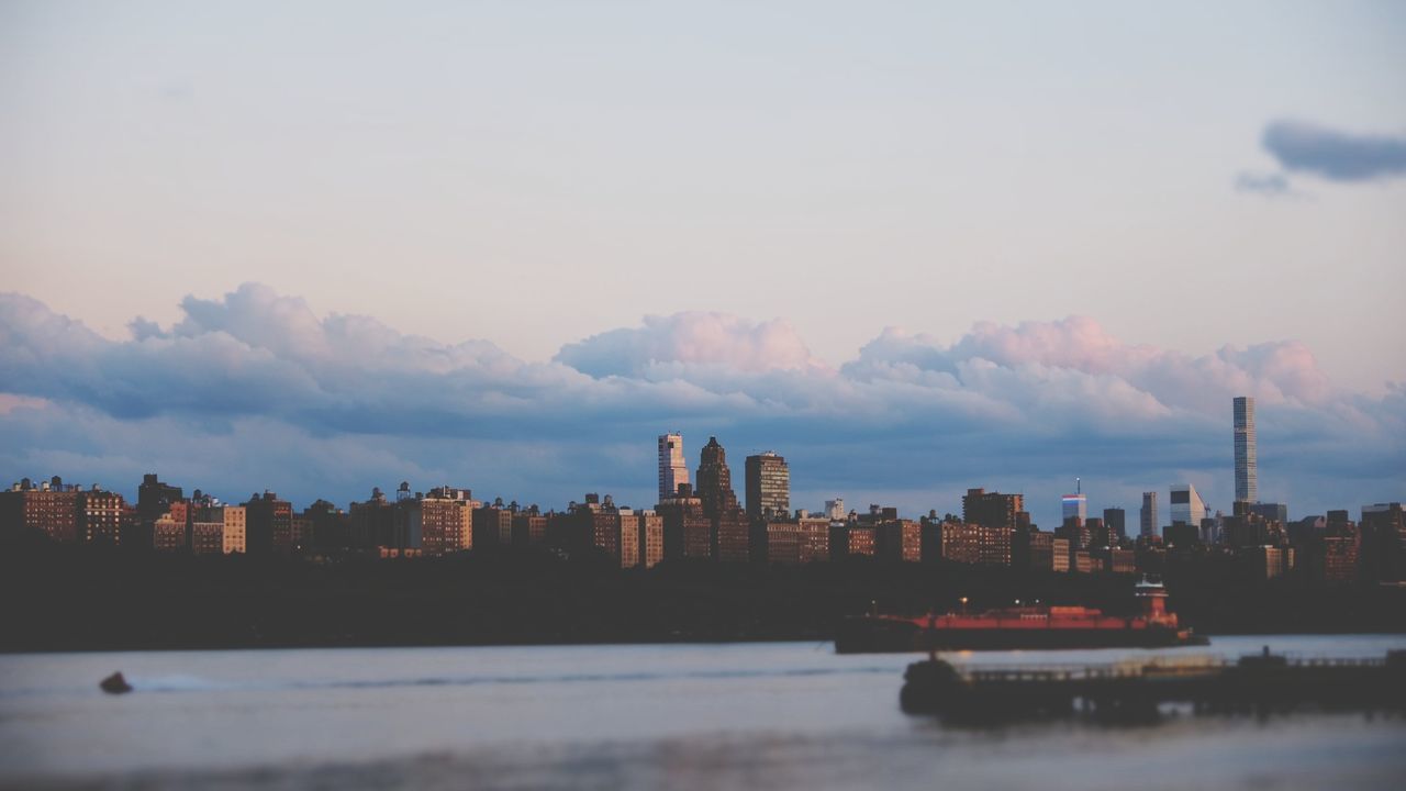 PANORAMIC VIEW OF BUILDINGS AGAINST SKY