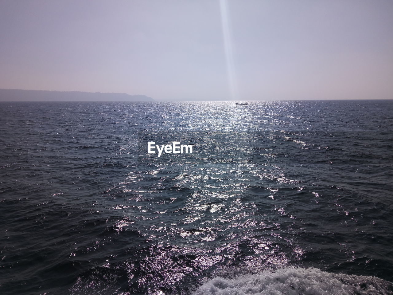 SCENIC VIEW OF SEA AGAINST RAINBOW