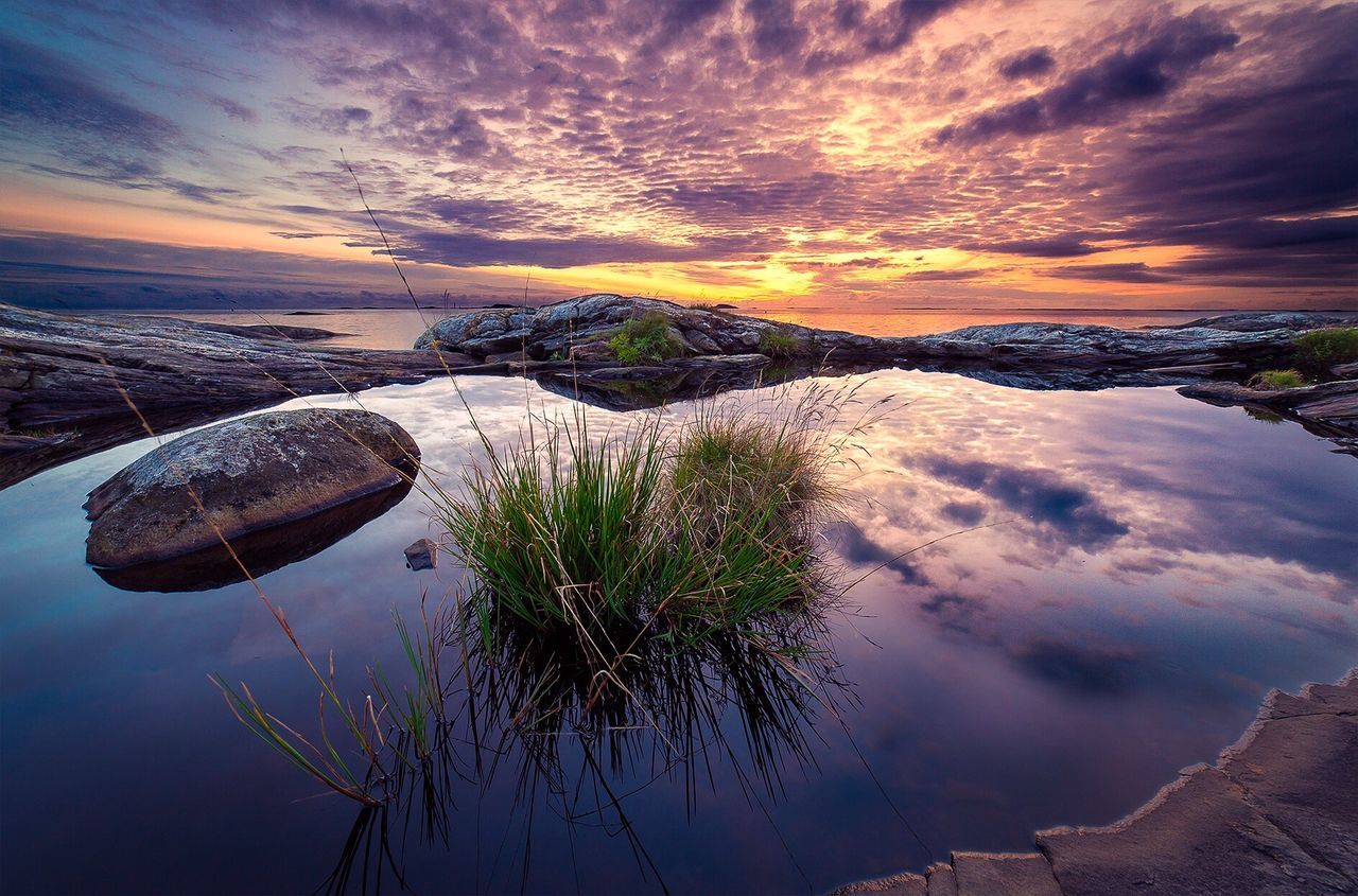 Scenic view of sea against sky at sunset