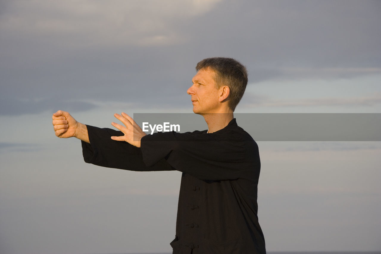 Close-up of a man practicing tai chi