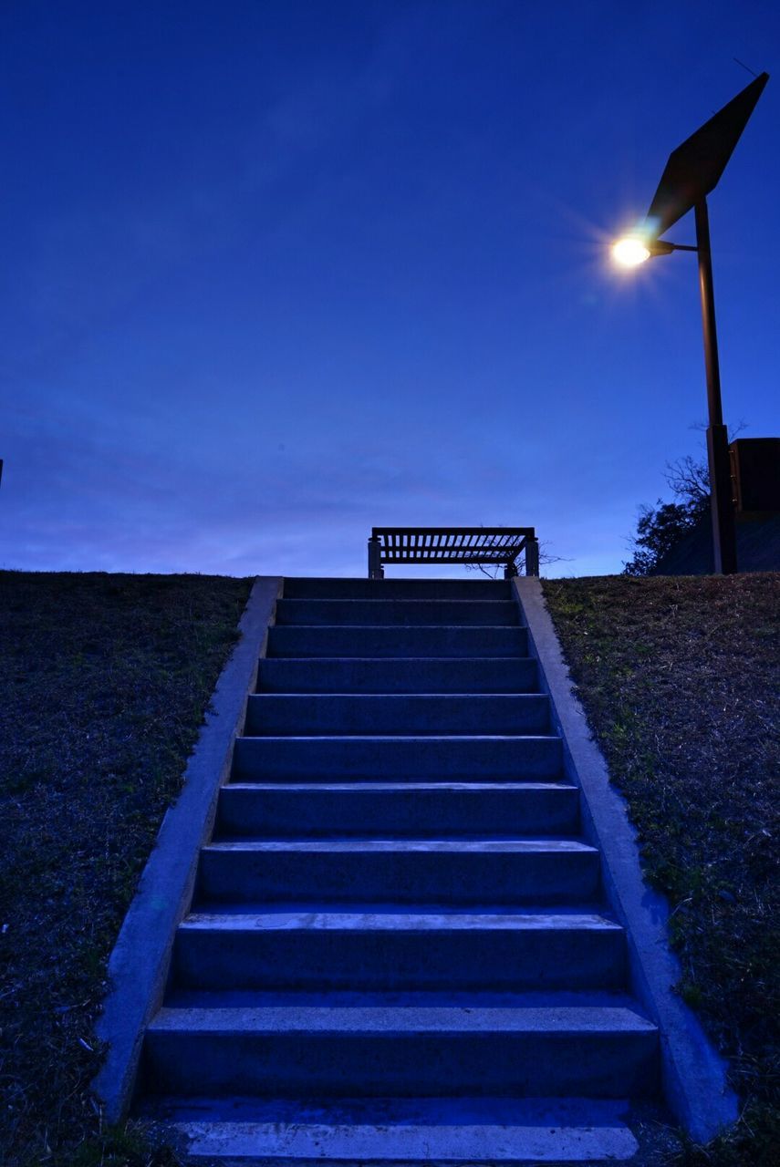 LOW ANGLE VIEW OF STEPS AGAINST BLUE SKY