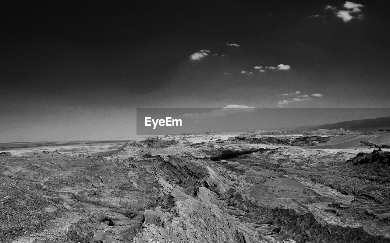 PANORAMIC VIEW OF LAND AND MOUNTAINS AGAINST SKY