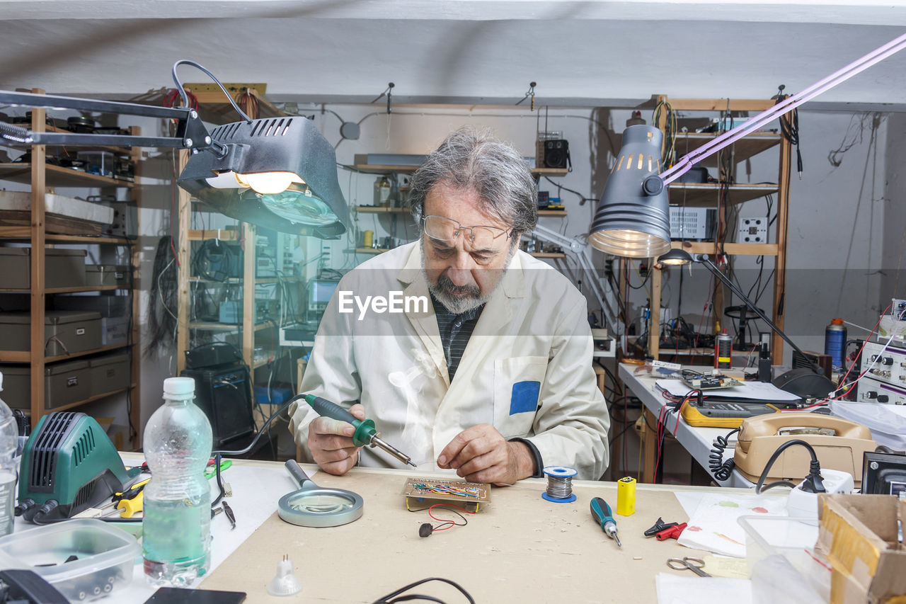 Electronic engineer in the laboratory with a soldering iron