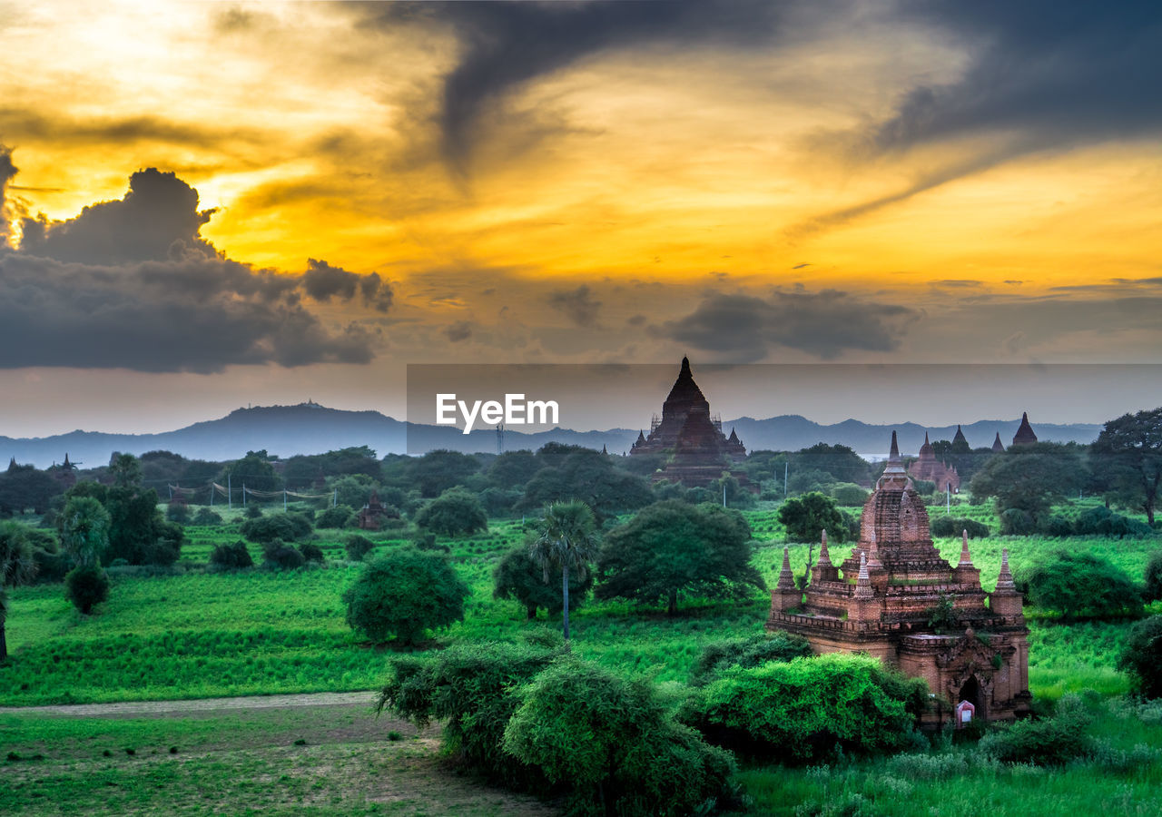 TEMPLE AGAINST CLOUDY SKY