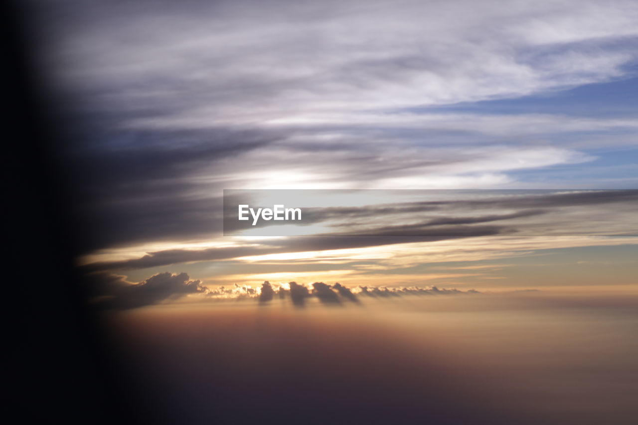 SCENIC VIEW OF DRAMATIC SKY OVER SILHOUETTE LANDSCAPE