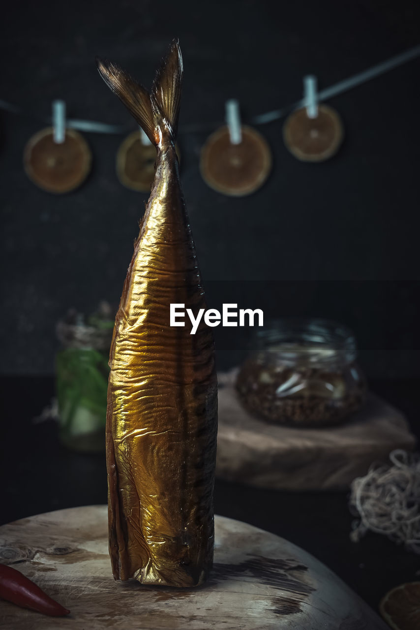 Close-up of fish standing  on table