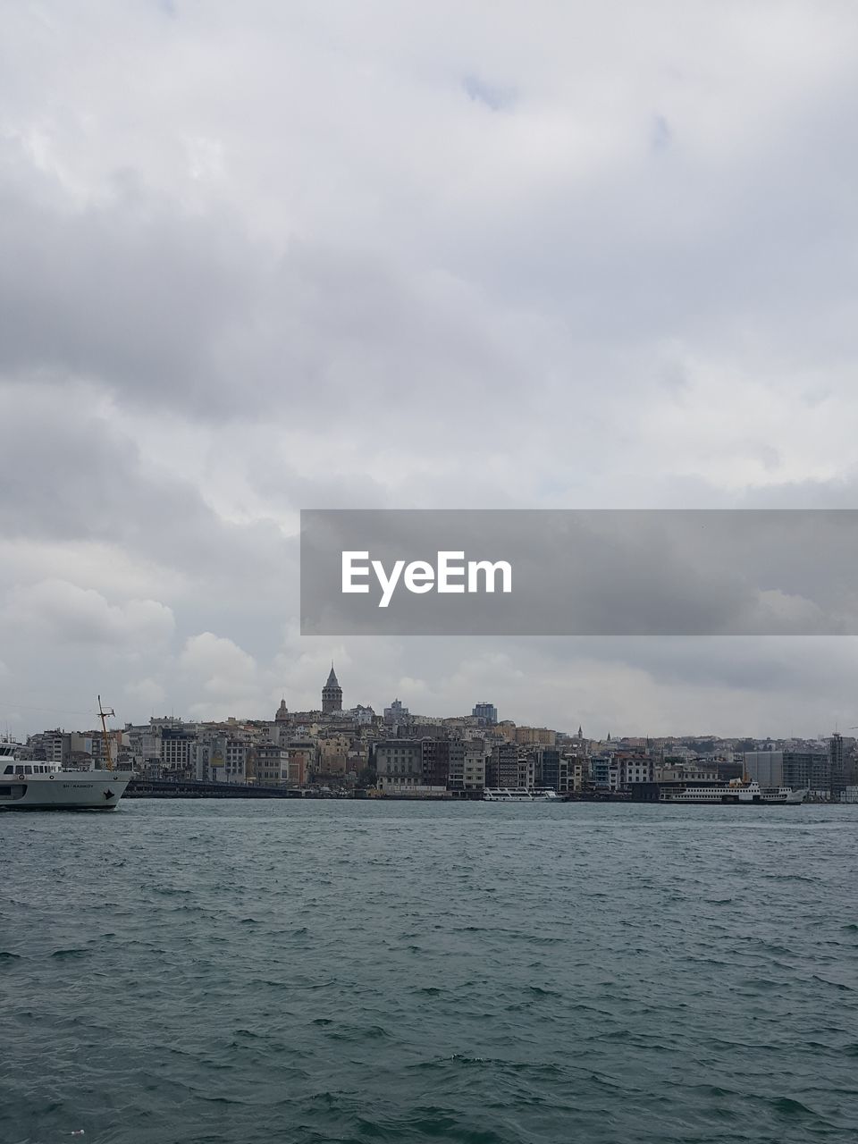 SEA AGAINST CLOUDY SKY