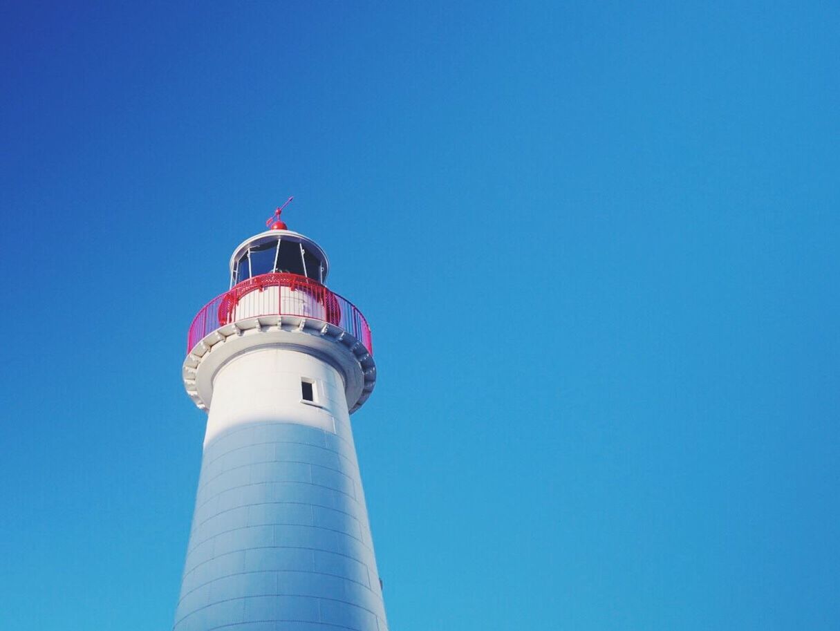 LIGHTHOUSE AGAINST CLEAR BLUE SKY