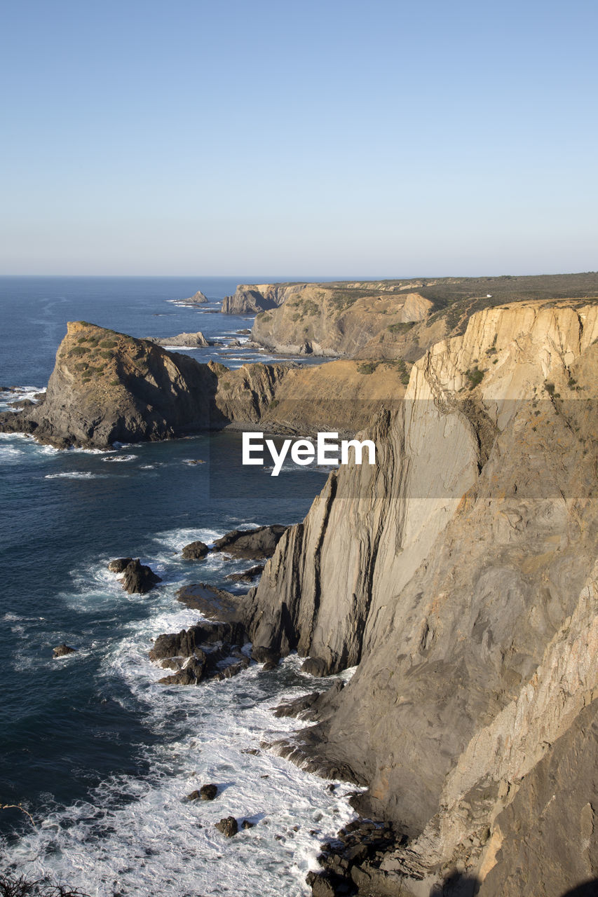 Scenic view of sea against clear sky