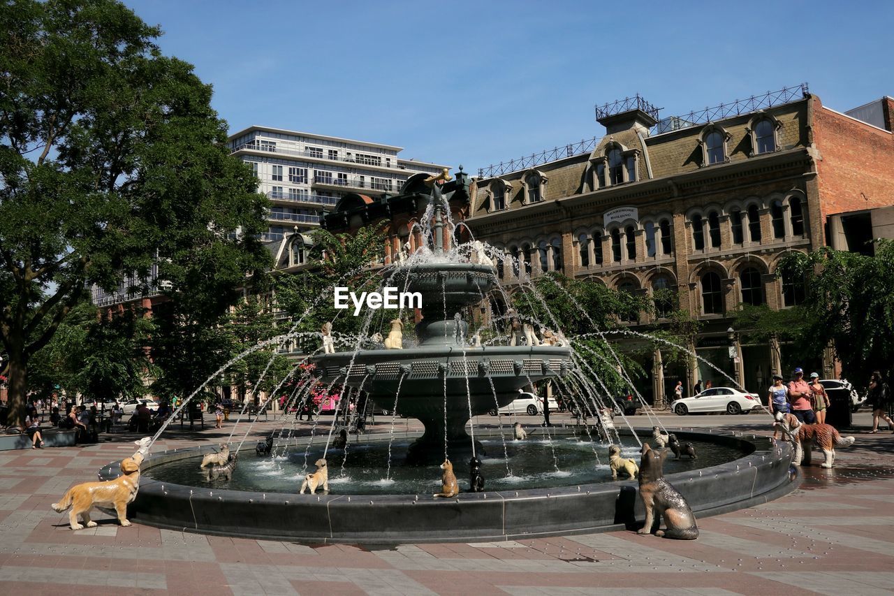 VIEW OF FOUNTAIN IN FRONT OF BUILDINGS