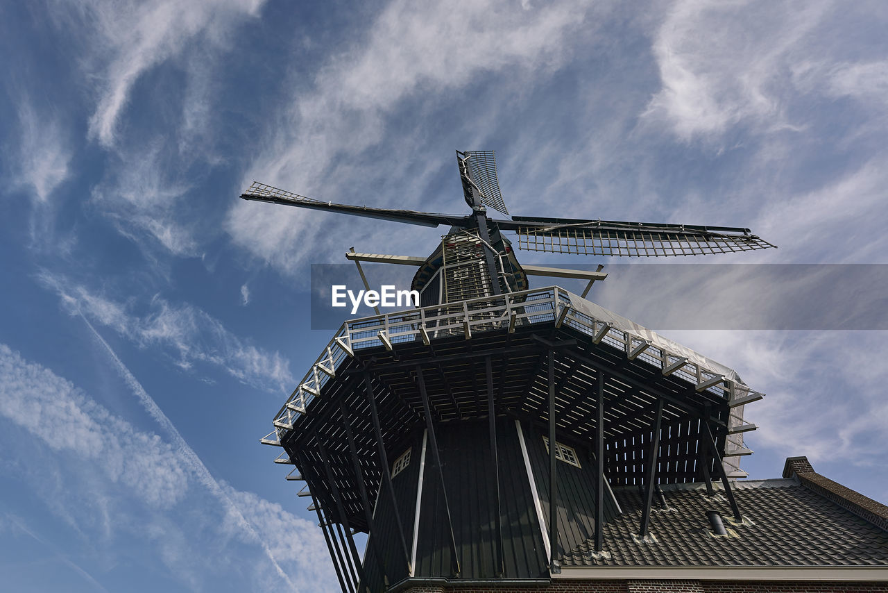 LOW ANGLE VIEW OF TRADITIONAL WINDMILL