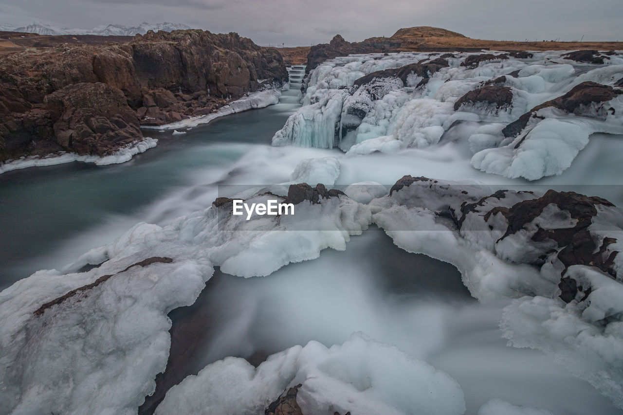 Full frame view of natural ice sculptures of a frozen waterfall