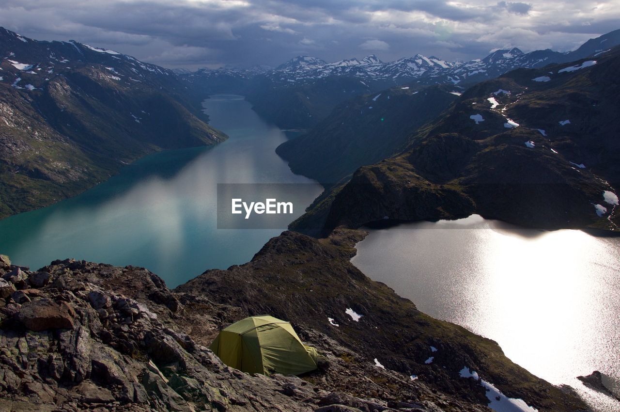 Scenic view of lake and mountains against sky