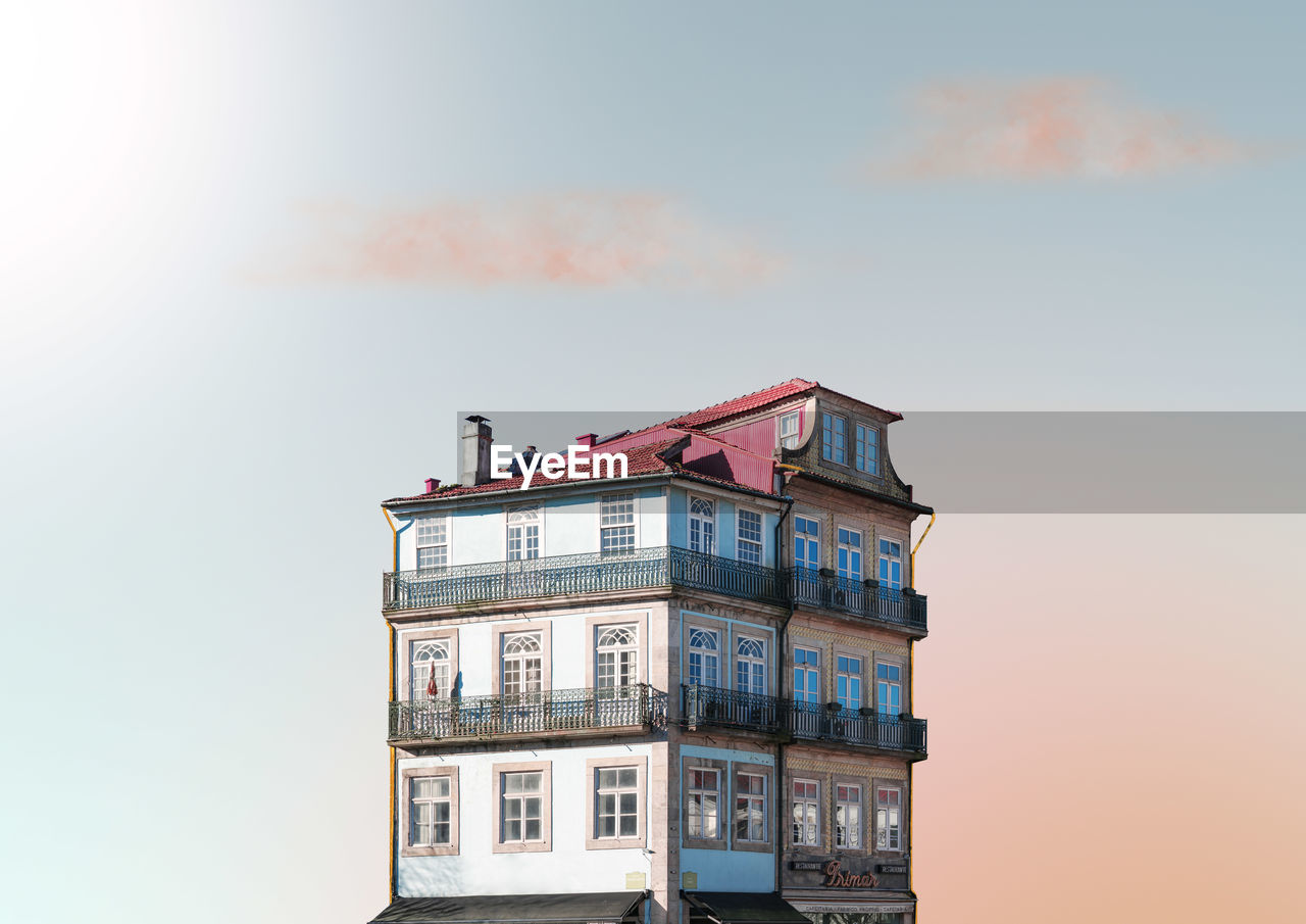 Low angle view of building against sky during sunset