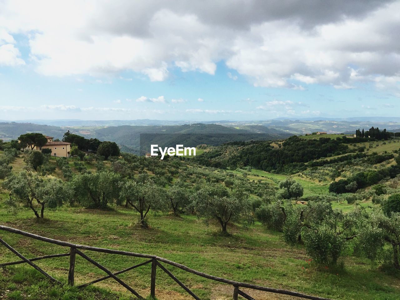 Scenic view of landscape against cloudy sky