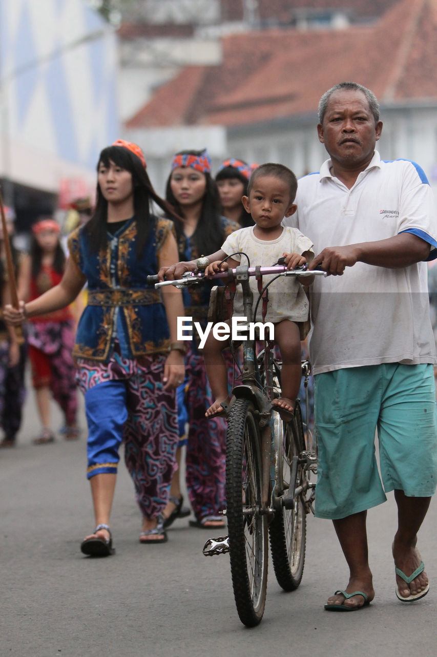 Crowd on street in city