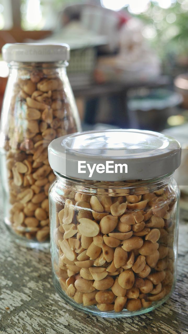 Close-up of cashews in jars on table