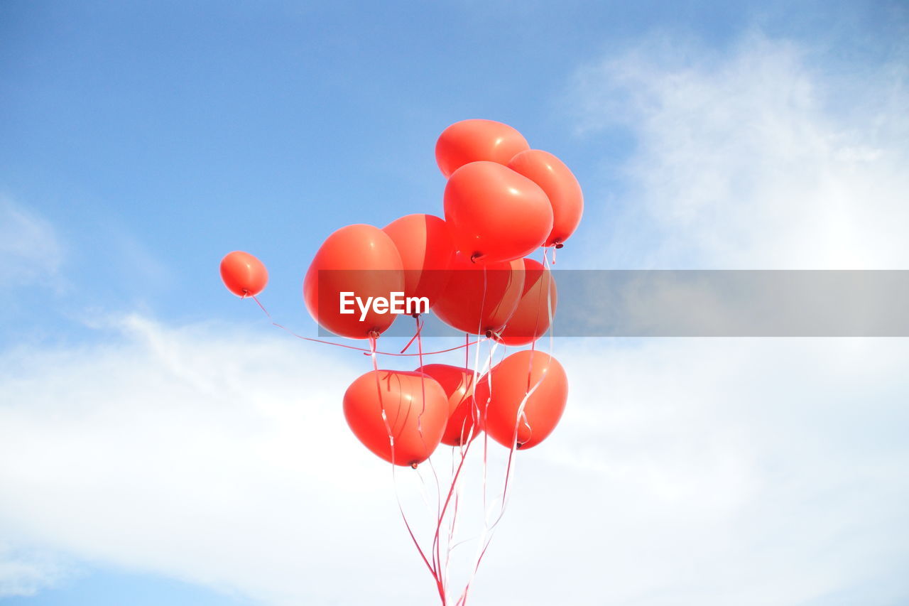 LOW ANGLE VIEW OF BALLOON BALLOONS AGAINST SKY