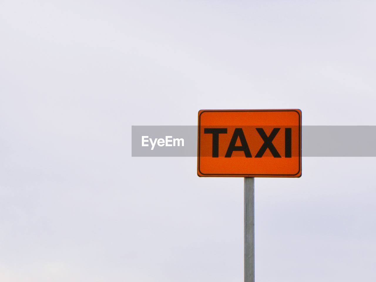 Low angle view of road sign against clear sky